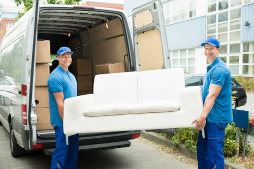 Man with van loading furniture for a UK move