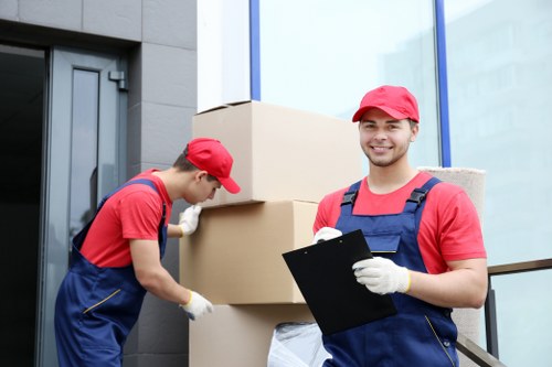 Workers loading a van safely with protective care