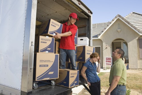 Local removal team handling furniture during a Beddington house move