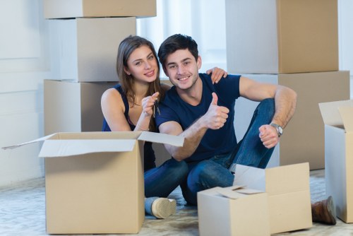 Professional movers handling household furniture during a Beddington relocation