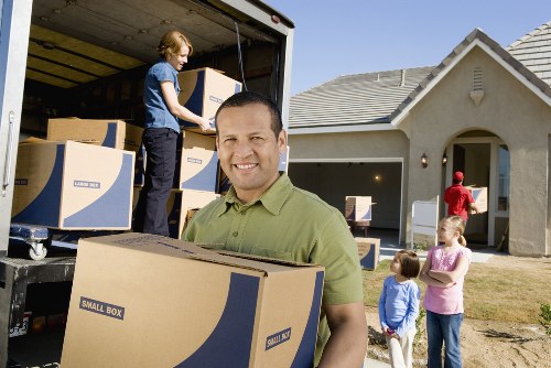 Careful furniture handling with safety precautions during loading